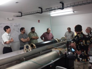 MRO and Cavendish Laboratory engineers inspect the delay line trolley at the MRO laboratory. 